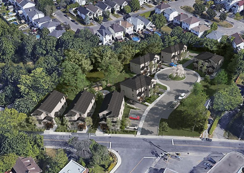 Photo aérienne du site : les onze habitations parmi les arbres matures et les propriétés voisines